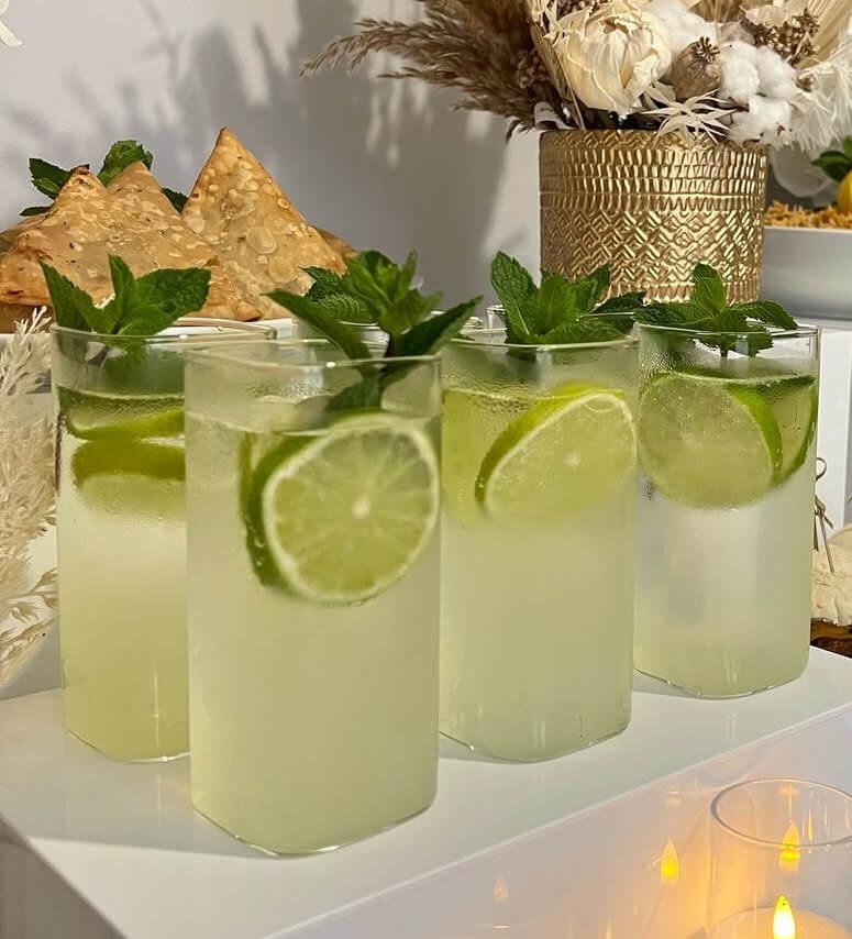 Lemon and mint mocktails with lime wheels and fresh mint